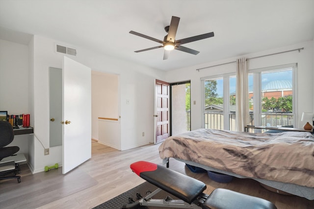 433 S Perkins Dr Unit 433, Memphis, TN 38117 - bedroom with visible vents, baseboards, light wood-type flooring, a ceiling fan, and access to outside