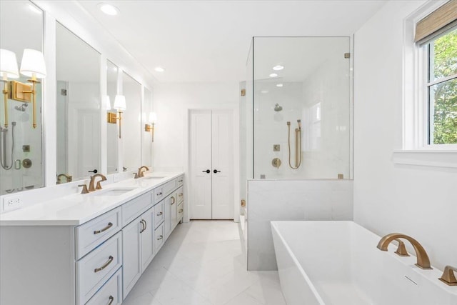 6555 Oak Estates Dr, Memphis, TN 38119 - full bath featuring a shower stall, a freestanding tub, double vanity, and a sink