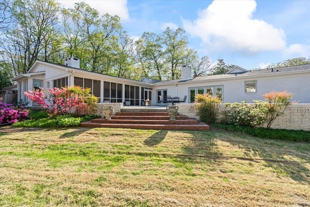 6555 Oak Estates Dr, Memphis, TN 38119 - rear view of house with a yard, a sunroom, and a chimney