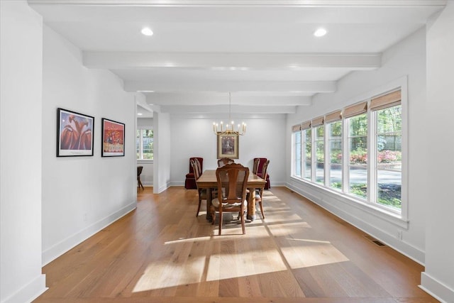 6555 Oak Estates Dr, Memphis, TN 38119 - dining room with light wood-type flooring, baseboards, and beam ceiling