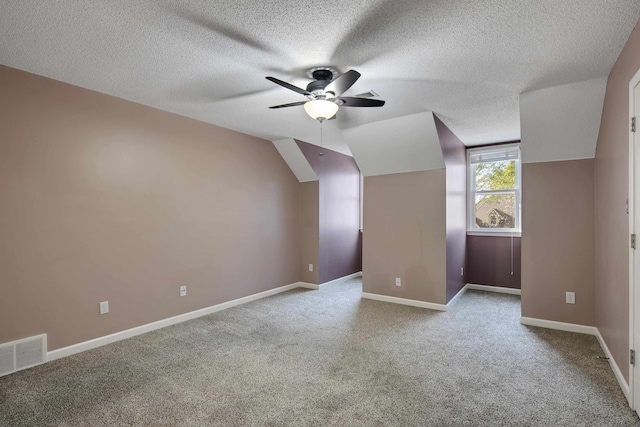 979 Welbeck Cv, Collierville, TN 38017 - bonus room with baseboards, a textured ceiling, visible vents, ceiling fan, and carpet