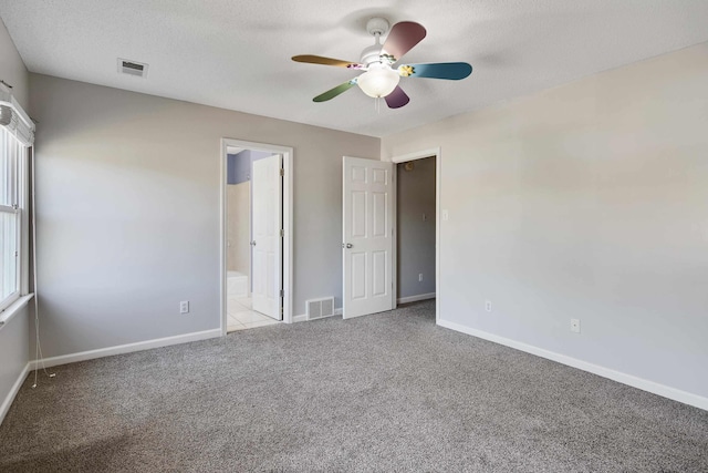 979 Welbeck Cv, Collierville, TN 38017 - unfurnished bedroom featuring visible vents, baseboards, a ceiling fan, and carpet flooring