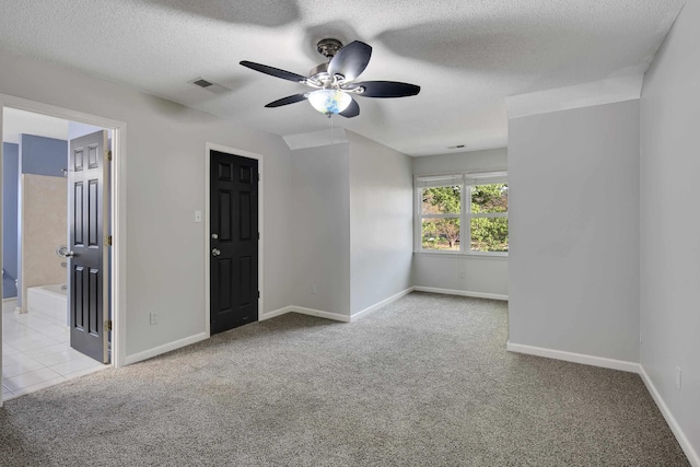 979 Welbeck Cv, Collierville, TN 38017 - spare room with a textured ceiling, a ceiling fan, visible vents, carpet flooring, and baseboards