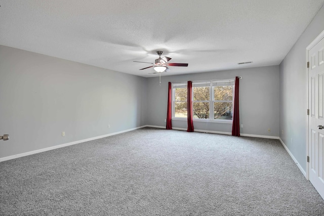 979 Welbeck Cv, Collierville, TN 38017 - spare room with visible vents, baseboards, ceiling fan, a textured ceiling, and carpet flooring