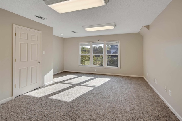 979 Welbeck Cv, Collierville, TN 38017 - carpeted empty room featuring a textured ceiling, baseboards, and visible vents