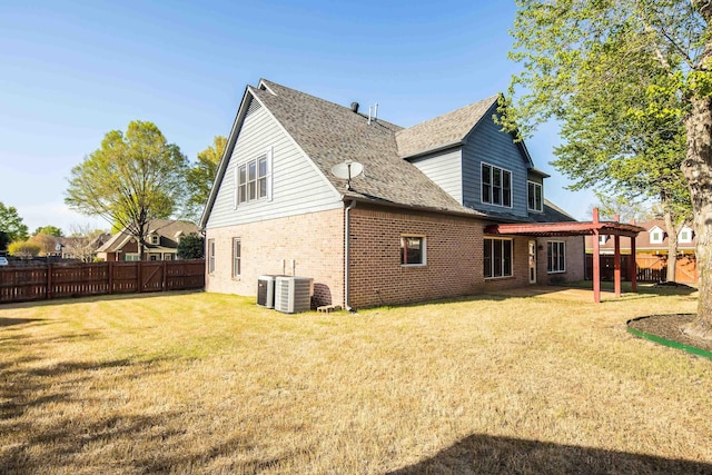 979 Welbeck Cv, Collierville, TN 38017 - back of house with a fenced backyard, a lawn, a patio, brick siding, and central AC unit