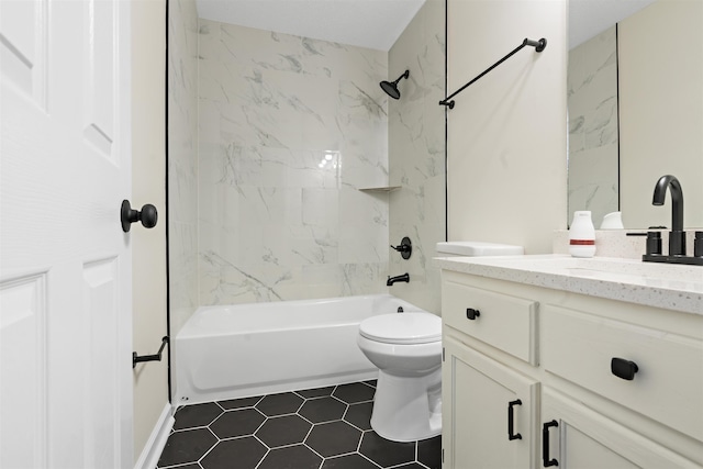 1098 Capital Ave, Memphis, TN 38107 - bathroom featuring toilet, vanity, tile patterned flooring, and tub / shower combination