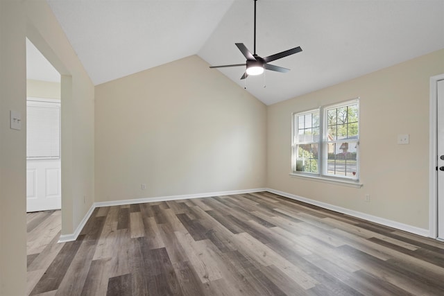 1098 Capital Ave, Memphis, TN 38107 - spare room with wood finished floors, ceiling fan, baseboards, and vaulted ceiling
