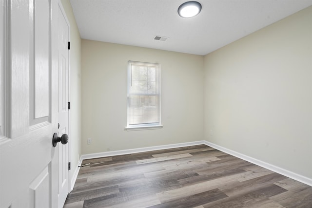 1098 Capital Ave, Memphis, TN 38107 - unfurnished room featuring visible vents, baseboards, and wood finished floors