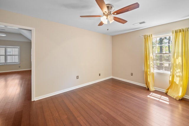 7545 Wheatley Dr, Germantown, TN 38138 - empty room featuring dark wood-type flooring, ceiling fan, and baseboards
