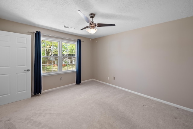 7545 Wheatley Dr, Germantown, TN 38138 - unfurnished room with baseboards, light carpet, a textured ceiling, visible vents, and ceiling fan