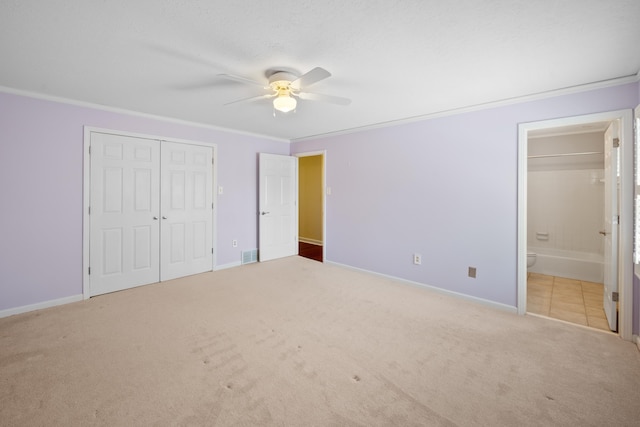 7545 Wheatley Dr, Germantown, TN 38138 - unfurnished bedroom featuring a closet, baseboards, visible vents, crown molding, and carpet floors