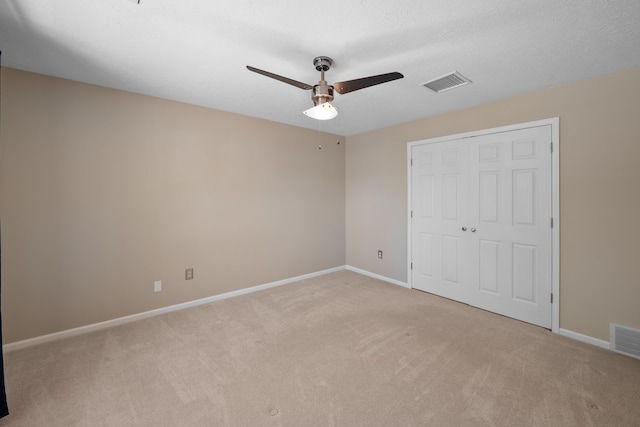 7545 Wheatley Dr, Germantown, TN 38138 - unfurnished bedroom featuring a closet, light colored carpet, baseboards, and visible vents