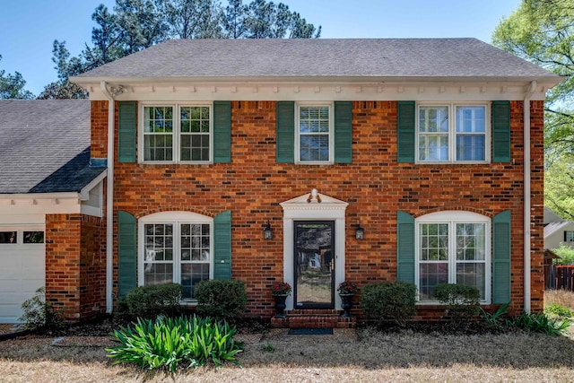 7545 Wheatley Dr, Germantown, TN 38138 - colonial inspired home with brick siding, an attached garage, and a shingled roof