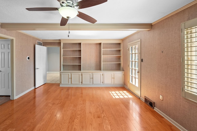 7545 Wheatley Dr, Germantown, TN 38138 - unfurnished living room with light wood-style flooring, baseboards, ornamental molding, and visible vents