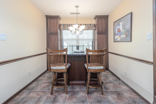 8453 Farrah Ln, Germantown, TN 38139 - dining room with visible vents, baseboards, and a notable chandelier