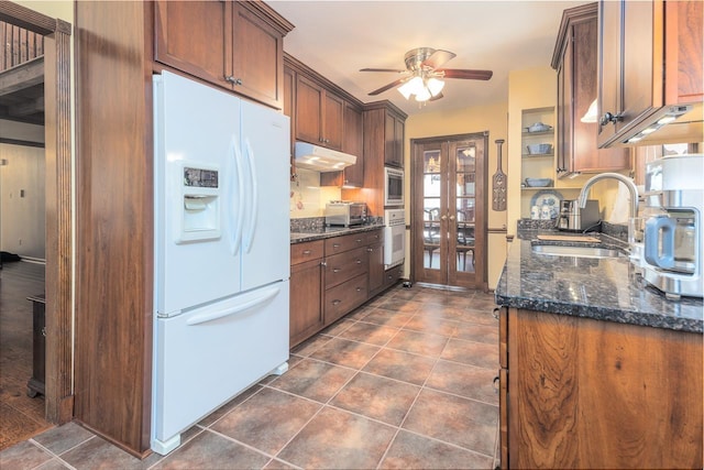 8453 Farrah Ln, Germantown, TN 38139 - kitchen with dark tile patterned floors, white appliances, under cabinet range hood, ceiling fan, and a sink