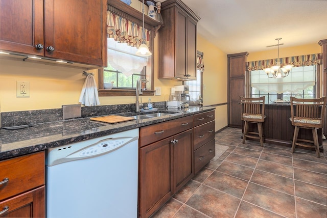 8453 Farrah Ln, Germantown, TN 38139 - kitchen featuring dark tile patterned flooring, dishwasher, a sink, hanging light fixtures, and a notable chandelier