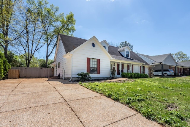 8453 Farrah Ln, Germantown, TN 38139 - cape cod house with driveway, fence, and a front lawn