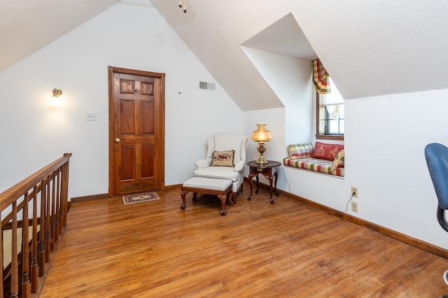 8453 Farrah Ln, Germantown, TN 38139 - sitting room with light wood-type flooring, baseboards, vaulted ceiling, and visible vents