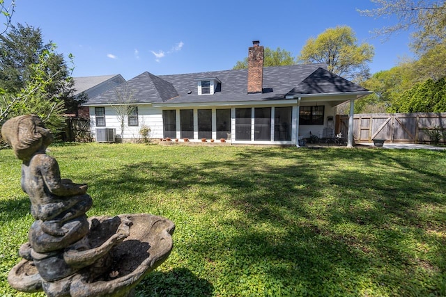 8453 Farrah Ln, Germantown, TN 38139 - back of house featuring a yard, fence, a sunroom, and a chimney