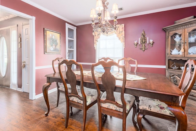 8453 Farrah Ln, Germantown, TN 38139 - dining space featuring ornamental molding, baseboards, an inviting chandelier, and wood finished floors