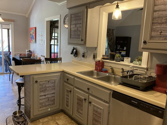 kitchen featuring a sink, dishwasher, a peninsula, a healthy amount of sunlight, and ornamental molding