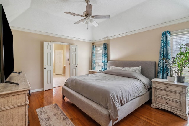 bedroom featuring crown molding, multiple windows, wood finished floors, and a ceiling fan