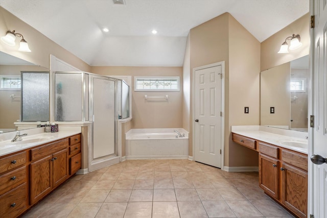 full bath with two vanities, a garden tub, a sink, lofted ceiling, and a stall shower