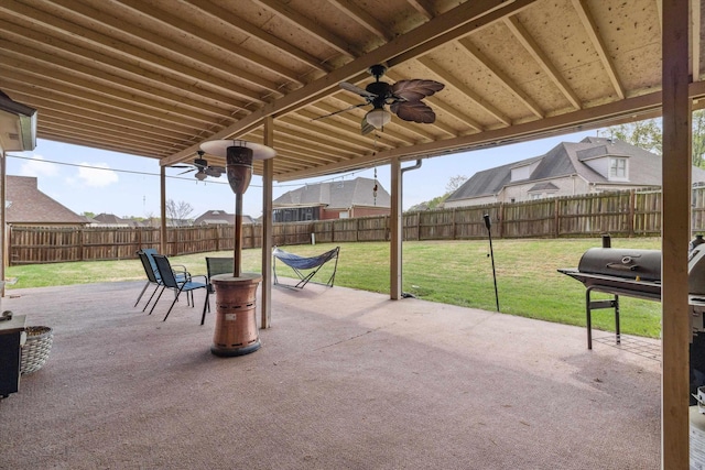 view of patio / terrace featuring fence, a ceiling fan, and a residential view