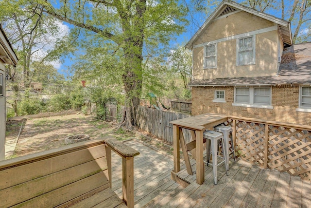889 N Avalon St N, Memphis, TN 38107 - wooden deck with a fire pit and a fenced backyard