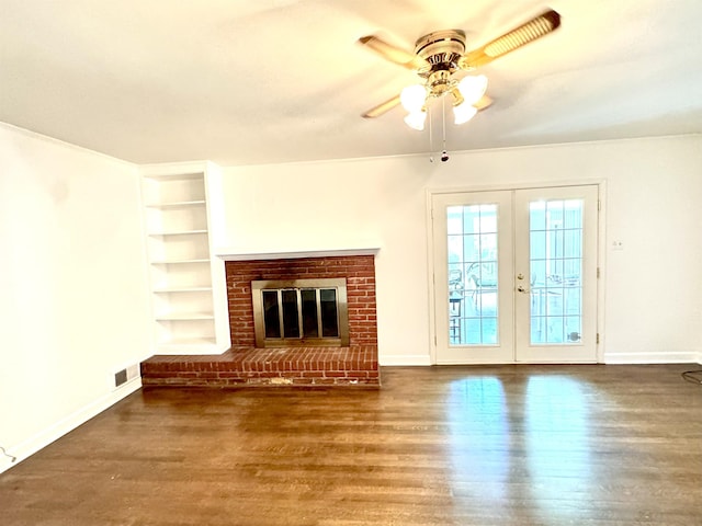 unfurnished living room featuring visible vents, built in features, wood finished floors, baseboards, and ceiling fan