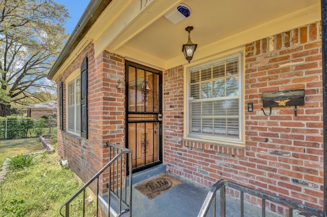 property entrance with brick siding