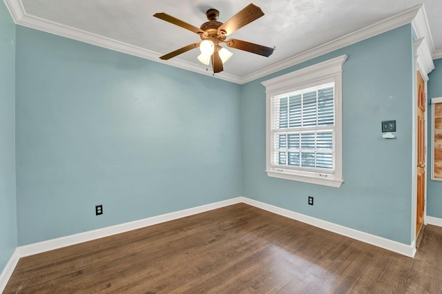 unfurnished room featuring dark wood-style flooring, ornamental molding, baseboards, and a ceiling fan