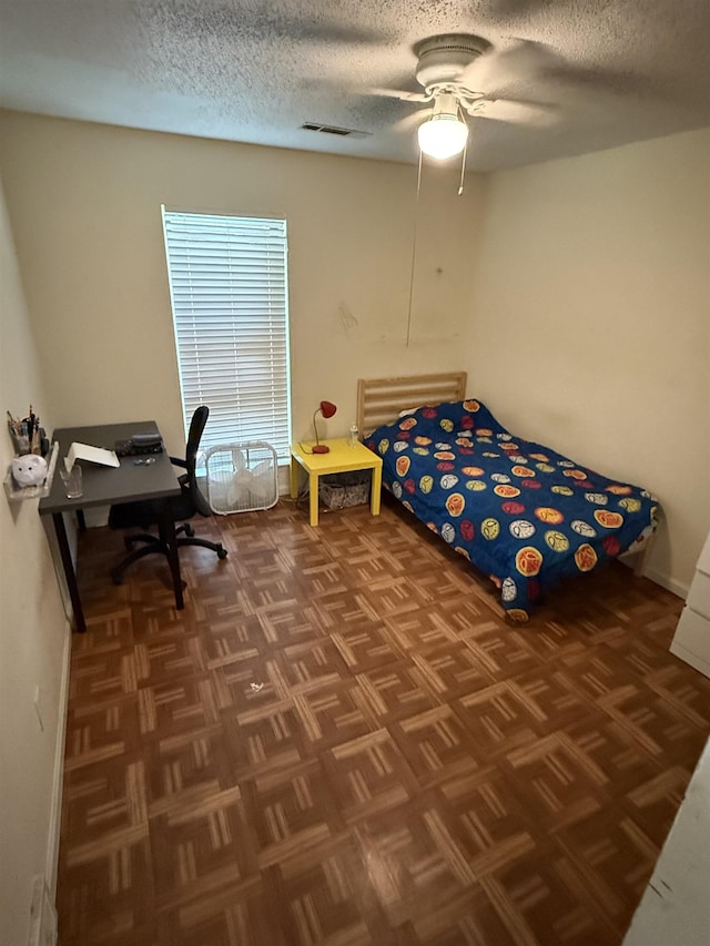 3287 Leschallas Dr, Memphis, TN 38128 - bedroom featuring visible vents, a textured ceiling, baseboards, and ceiling fan