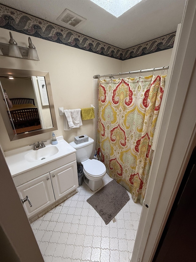 3287 Leschallas Dr, Memphis, TN 38128 - bathroom featuring toilet, curtained shower, vanity, and visible vents