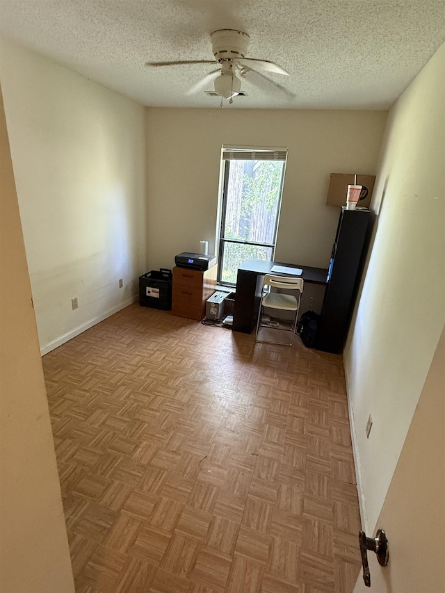 3287 Leschallas Dr, Memphis, TN 38128 - home office featuring baseboards, a ceiling fan, and a textured ceiling