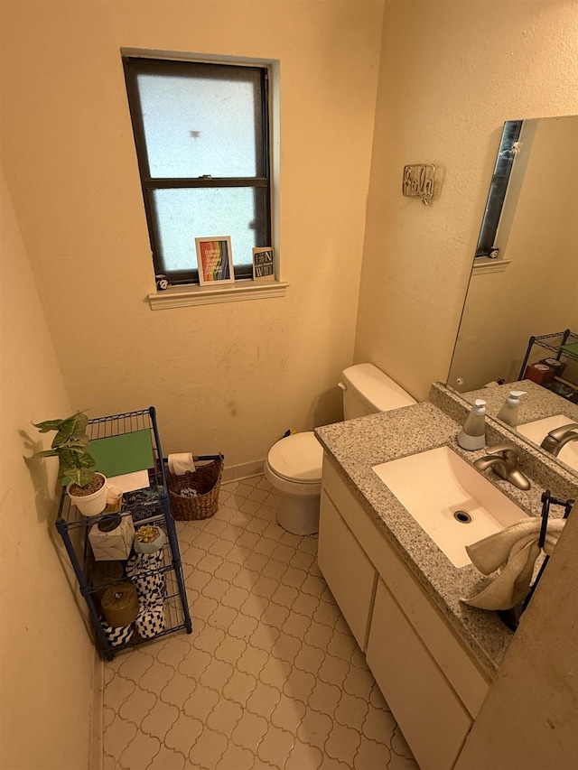 3287 Leschallas Dr, Memphis, TN 38128 - bathroom with toilet, tile patterned floors, vanity, and baseboards