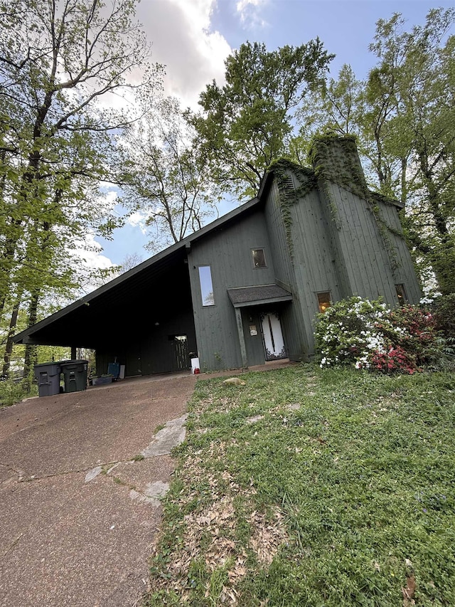 3287 Leschallas Dr, Memphis, TN 38128 - view of property exterior featuring a yard and concrete driveway