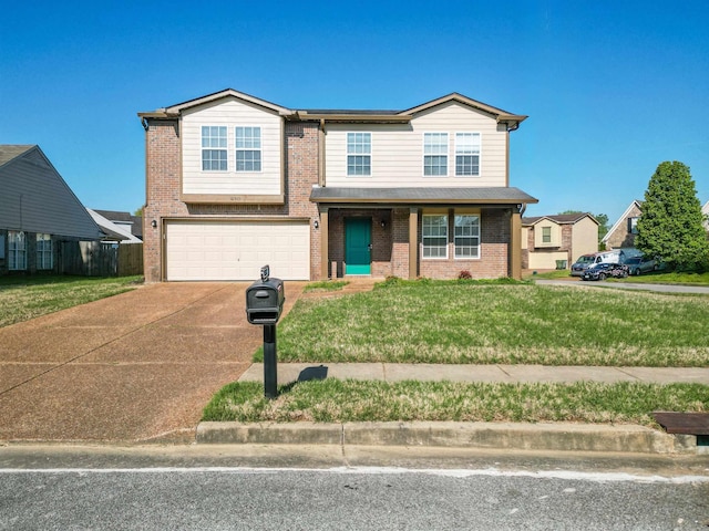 10317 Cottage Oaks Dr, Memphis, TN 38016 - view of front of property featuring brick siding, a front yard, an attached garage, and concrete driveway