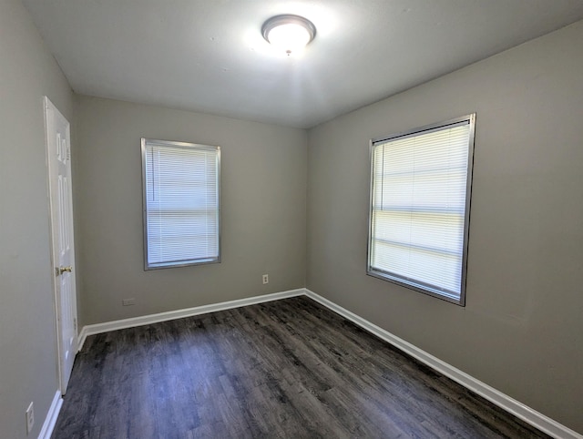 1337 Haywood Ave, Memphis, TN 38127 - unfurnished room with dark wood-style floors and baseboards