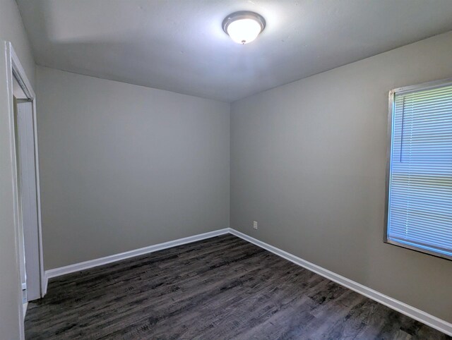 1337 Haywood Ave, Memphis, TN 38127 - unfurnished room with dark wood-type flooring and baseboards