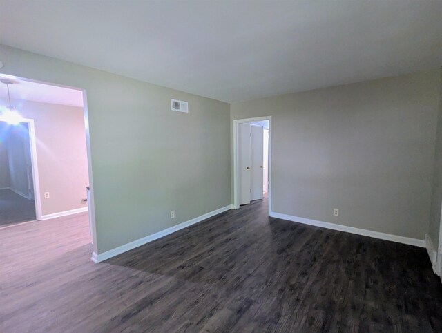 1337 Haywood Ave, Memphis, TN 38127 - unfurnished room with dark wood-style floors and baseboards