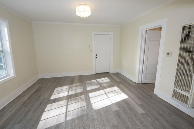 899 Craft Rd, Memphis, TN 38116 - spare room featuring baseboards, a heating unit, crown molding, and wood finished floors