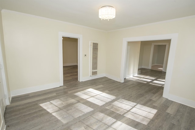 899 Craft Rd, Memphis, TN 38116 - spare room featuring an inviting chandelier, baseboards, crown molding, and wood finished floors