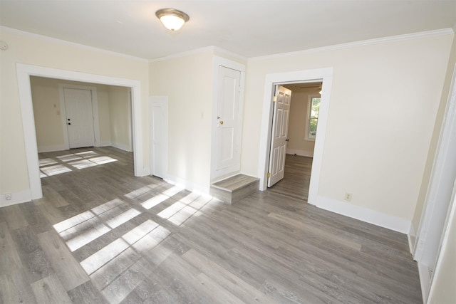 899 Craft Rd, Memphis, TN 38116 - spare room with crown molding, baseboards, and wood finished floors