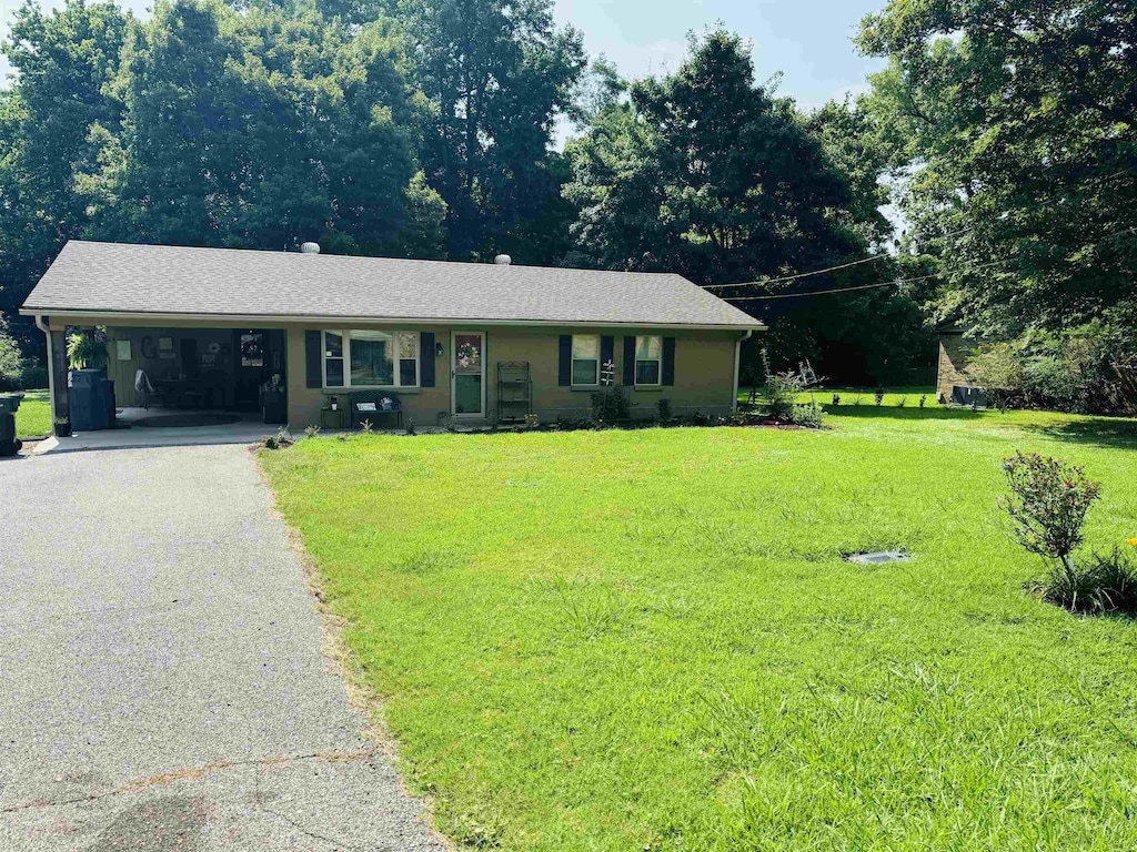 50 Caldwell Cir, Ripley, TN 38063 - ranch-style house featuring driveway, a front yard, and an attached carport