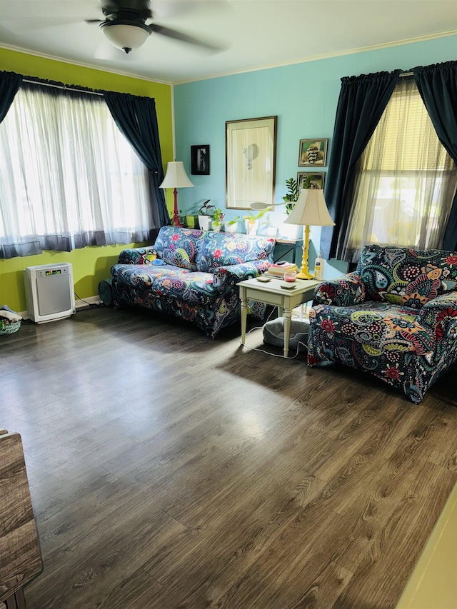 living room with ceiling fan and wood finished floors