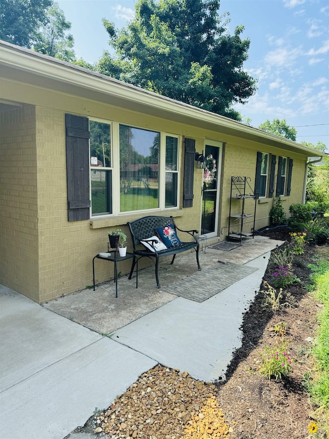 exterior space with brick siding