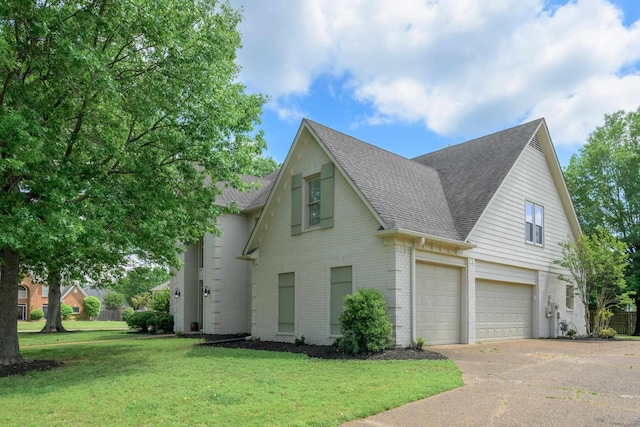 traditional-style house with a front yard, brick siding, concrete driveway, roof with shingles, and an attached garage